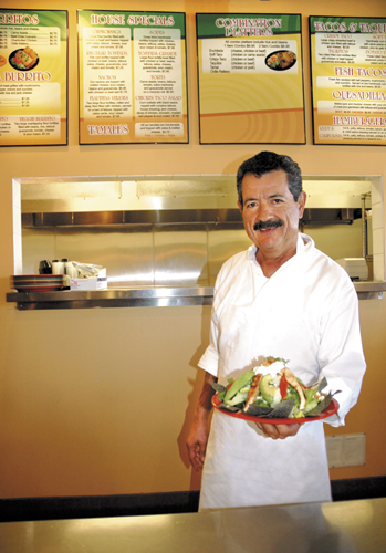Rudy Alvaro, Sr., with one of the popular Mexican chicken-avocado taco salads served at Rudy’s in Buellton. He opened his first Rudy’s Mexican Restaurant in Santa Barbara in 1976. 